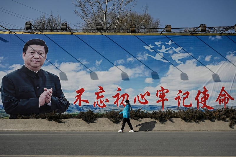 图为墙上张贴习近平的宣传标语。(资料图/美联社)