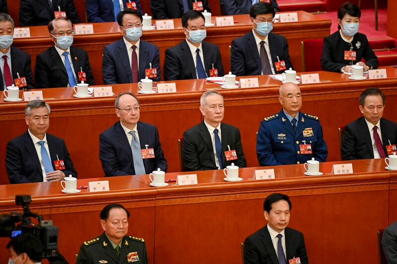 Politburo Standing Committee member Li Xi, Beijing Communist Party Secretary Yin Li, China's Vice Premier Liu He, Vice Chairman of China's Central Military Commission Xu Qiliang and CPC Central Committee Political Bureau member Li Ganjie attend the fourth plenary session of the National People's Congress (NPC) at the Great Hall of the People in Beijing, March 11, 2023. (Greg Baker/Pool via Reuters)