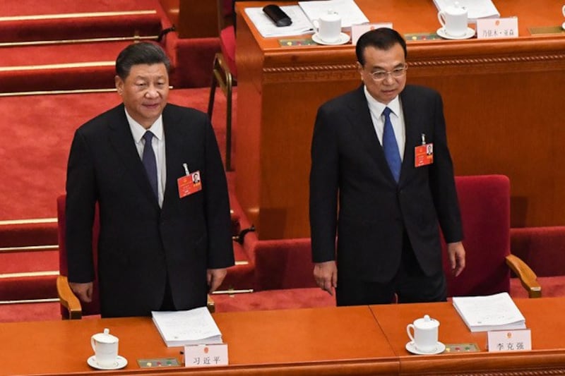 李克强总理在政府工作报告中指出,当前和今后一个时期,中国发展面临的风险挑战前所未有。(法新社)