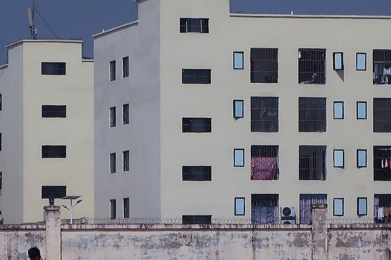 This image released by Amnesty International on June 26, 2025, as part of a report on scam centers in Cambodia shows “caged windows and barbed or razor wire on internal walls of a scamming compound.”
