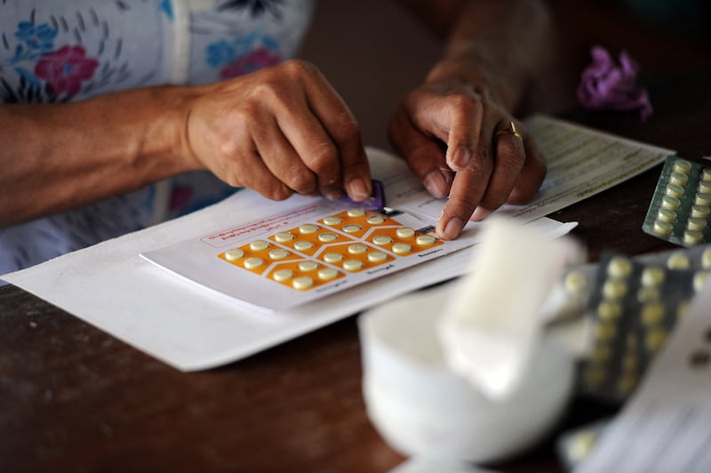 A worker packs medicine delivered into the country by the United States Agency for International Development (USAID) in Yangon, March 7, 2013.
