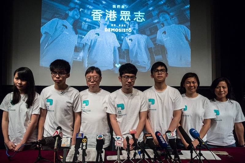 香港众志成员黄之锋、罗冠聪及周庭等。(AFP)