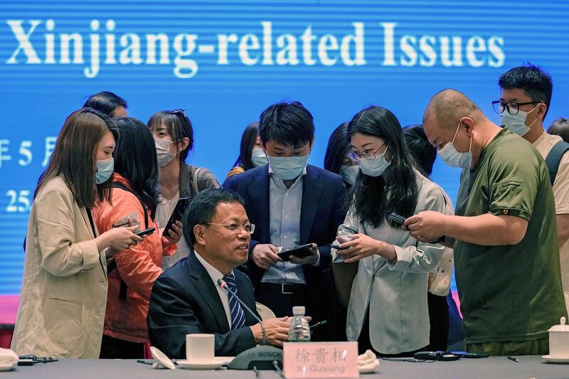 2021年5月25日,新疆维吾尔自治区人民政府发言人徐贵相在北京就涉疆问题举行记者会上。(美联社)