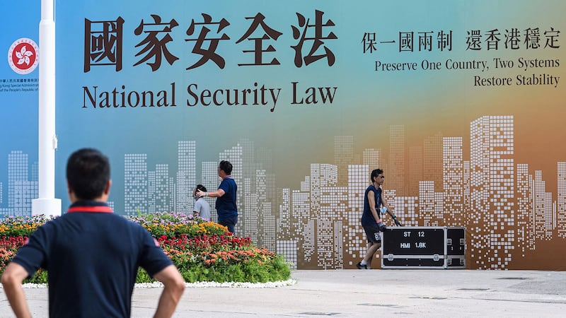 《香港国安法》实施不足3年,但为国安法设立的举报热线,已收到逾40万条举报讯息。(法新社资料图片)
