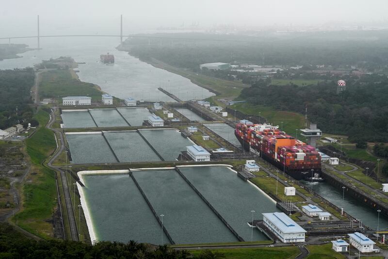 An aerial view shows a cargo vessel transits through the Cocoli Locks at the Panama Canal, in Panama City, Panama, February 1, 2025. REUTERS/Enea Lebrun