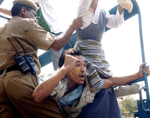 tibetan-protesters-arrested-4-12-05-150.gif